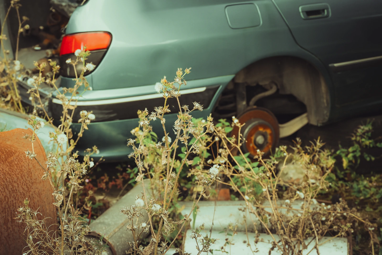Damaged and broken-down junk sedan